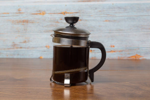 istock French press with black coffee on wooden boards 1305332397
