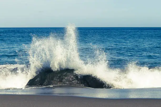 Atlantic ocean, strong waves, splashing, breaking on coast, rocks, volcanic island, Azores.