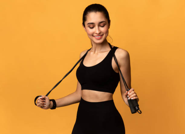 istock Young Woman Posing With Jumping Rope At Studio 1305333723