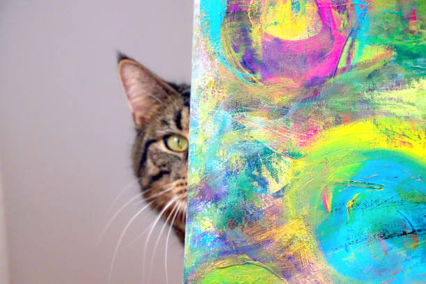 istock Kitten peeking behind an art piece 1305333902