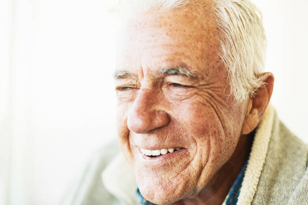 istock Senior man with white hair laughs happily 1305336133
