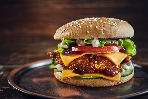 Crispy Chicken Burger with Cheese, Tomato, Onions and Lettuce