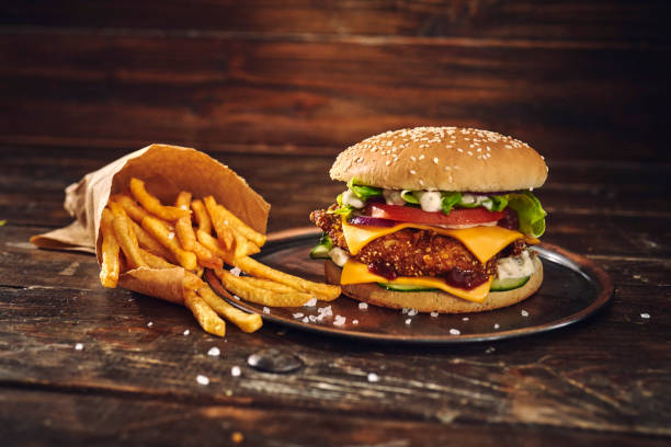 istock Crispy Chicken Burger with Cheese, Tomato, Onions and Lettuce 1305337886