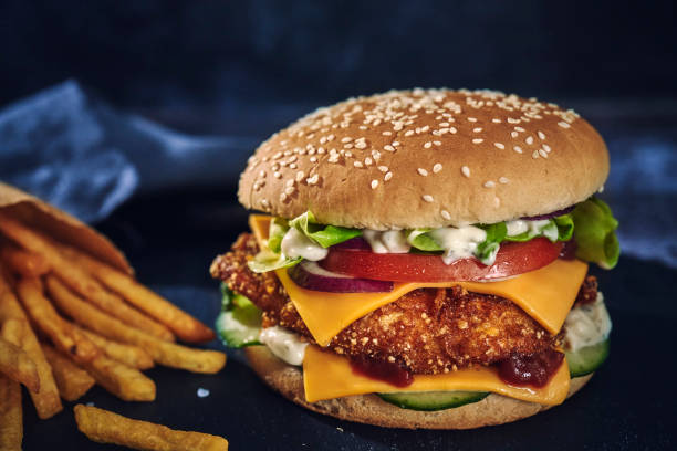 istock Crispy Chicken Burger with Cheese, Tomato, Onions and Lettuce 1305337905