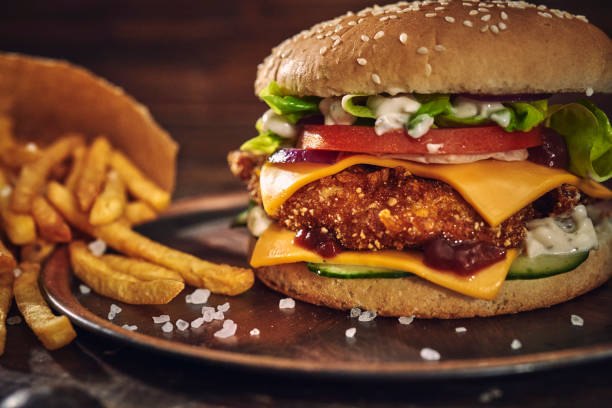istock Crispy Chicken Burger with Cheese, Tomato, Onions and Lettuce 1305337906