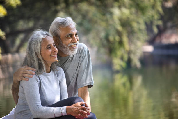 istock Senior couple admiring view at park 1305338048