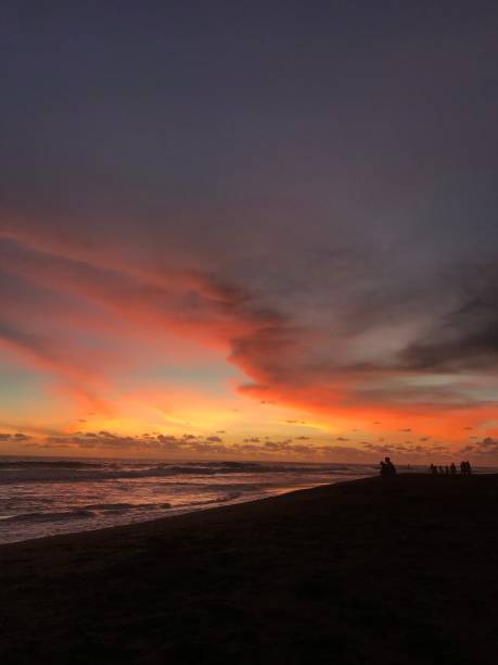 istock Beautifull orange sky at the beach 1305339355