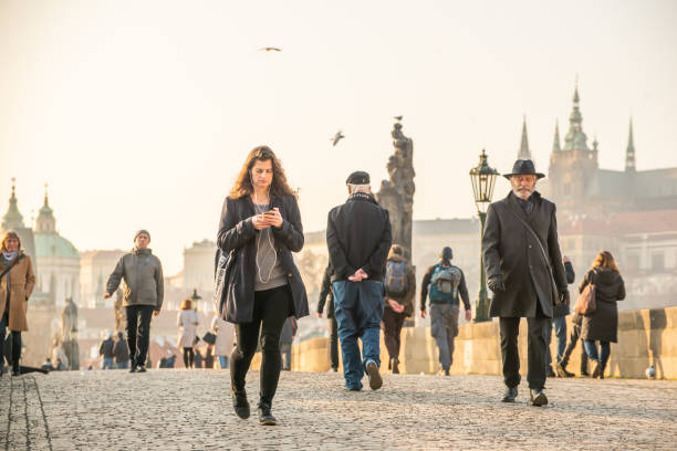 tourist in the city center of prague having a good time on a sunny winter day - begging currency parent teenager imagens e fotografias de stock