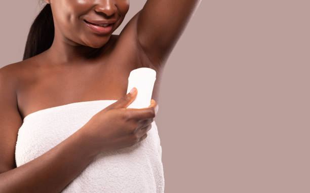 istock Young Black Woman Using Antiperspirant Stick For Underarms For Sweating Prevention 1305343424