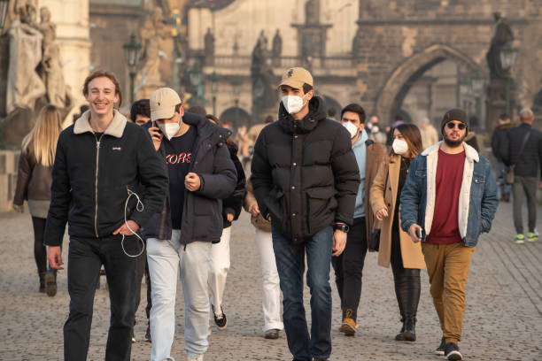 Tourist in the city center of Prague having a good time on a sunny winter day stock photo