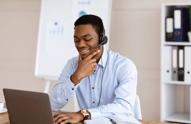 istock Positive young black man having business conference in office 1305345931