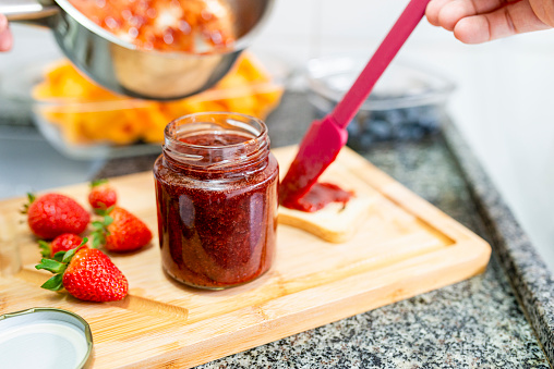 Detail of home made strawberry jam jar.