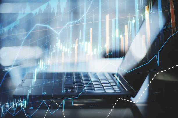 istock Financial analysis concept with opened laptop and digital screen with financial graphs, candlestick and diagram 1305347053
