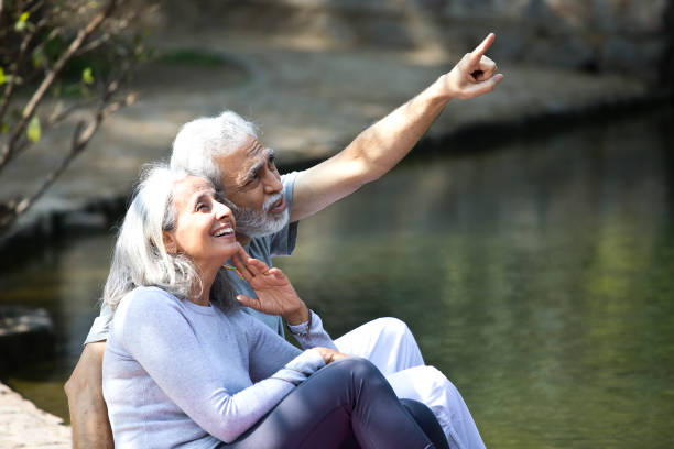 istock Senior couple admiring view at lakeshore 1305348492