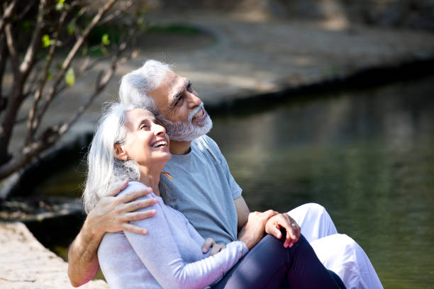 istock Senior couple admiring view at park 1305348663