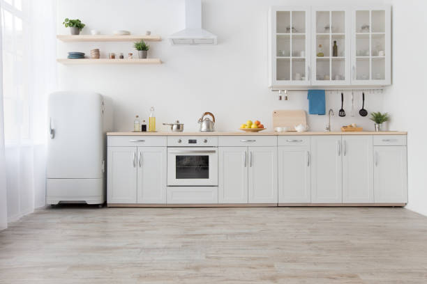 istock White scandinavian kitchen interior with dining room and wooden floor 1305348680