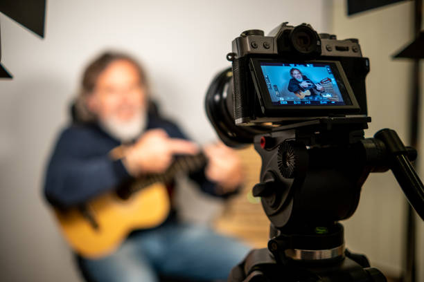 istock Man giving guitar lesson via streaming 1305349596