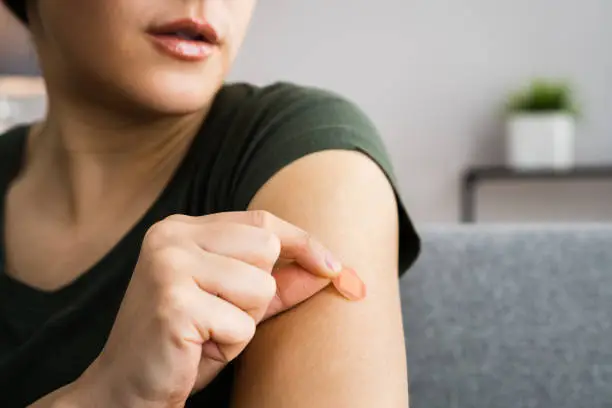 Woman With Contraception Patch Treatment On Arm