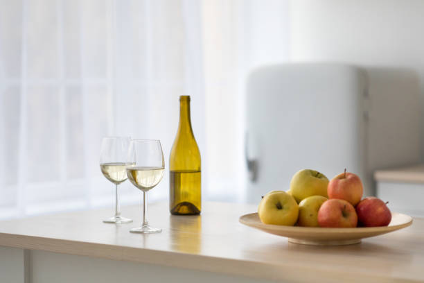 istock Wine and fruit for party and date in modern simple kitchen interior 1305351107
