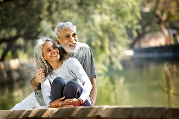 istock Senior couple admiring view at park 1305352523
