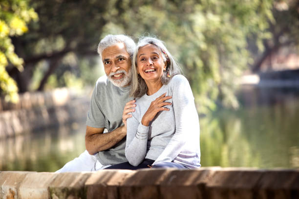 istock Senior couple admiring view at park 1305352615