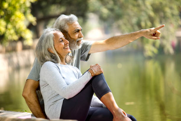 istock Senior couple admiring view at lakeshore 1305353865