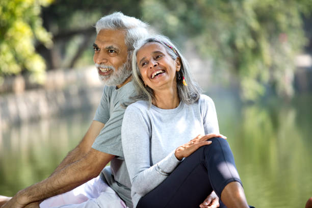 istock Loving senior couple spending leisure time by lakeshore 1305353959