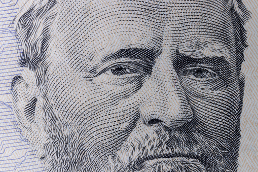 President Ulysses S. Grant on the obverse of a fifty dollar bill for background.