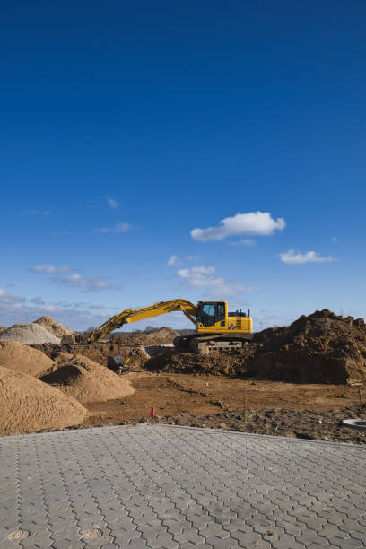 istock new development area, power shovel,digger, construction vehicle 1305355712