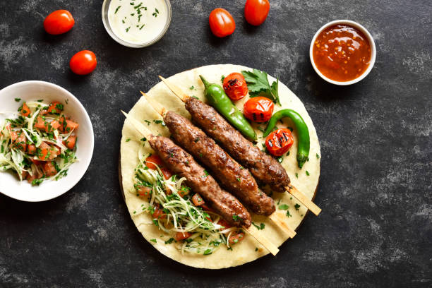istock Turkish Adana Kebab with fresh vegetables 1305357036