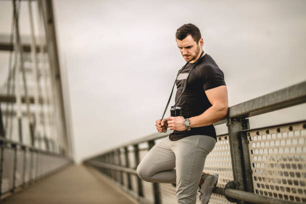 istock Portrait of a handsome young athlete using a skipping rope during an outdoor training session 1305358009