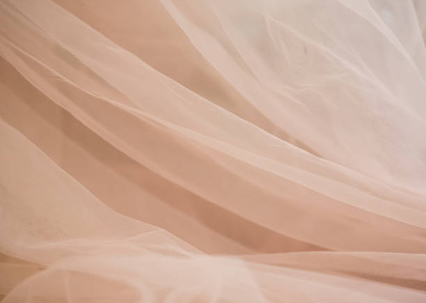 istock delicate soft beige fabric abstract background with blur 1305358557