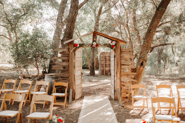istock Vintage rustic venue in eucalyptus forest.  Rustic wooden outdoor ceremony. 1305359747