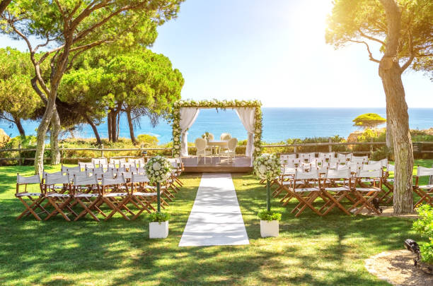 istock Beautiful wedding by the ocean, outdoors on a sunny day. 1305359898