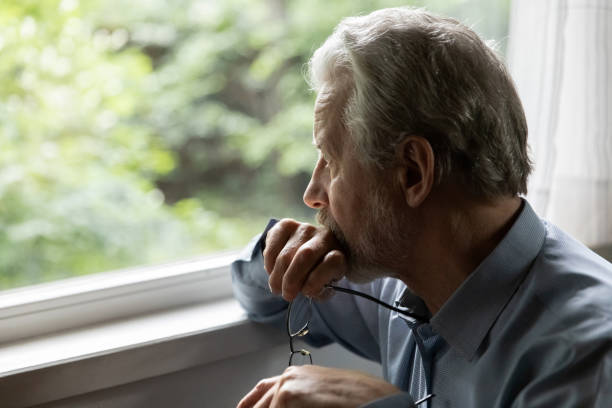 istock Pensive mature 70s aged man in deep thoughts 1305359985