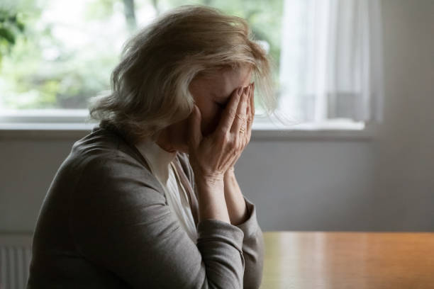 istock Depressed mature OAP 60s woman going through crisis 1305360591