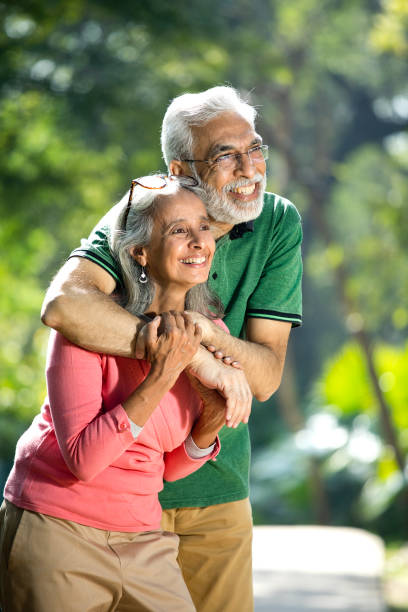 istock Happy senior couple admiring view at park 1305362207