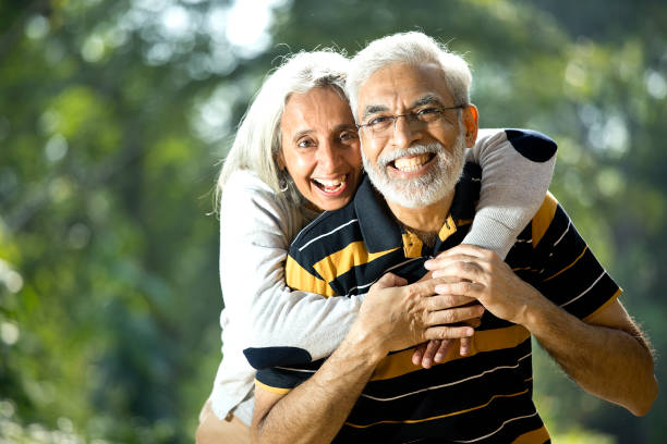 istock Loving senior couple at park 1305364096