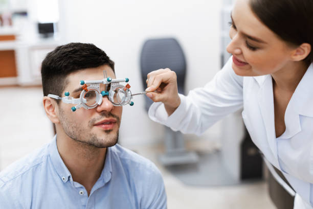 istock Optometrist checking male patients vision with trial frame 1305364838