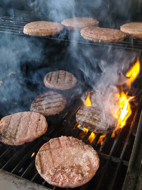 istock Cooking Hamburger Patties on Infrared Grill 1305366152