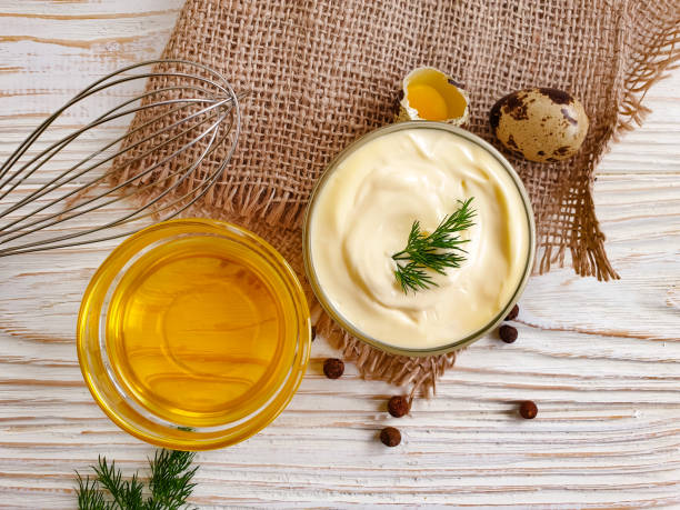 istock homemade mayonnaise, quail eggs on wooden background 1305367661