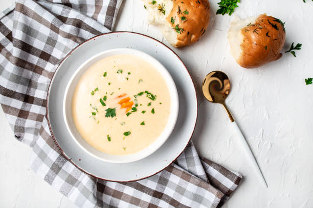 Homemade potato cheese cream soup on a light background, top view Homemade potato cheese cream soup on a light background, top view. cream soup stock pictures, royalty-free photos & images