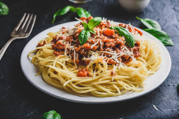 istock Spaghetti with bolognese sauce and parmesan cheese 1305374416