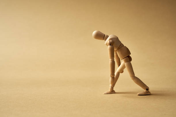 istock Wooden figure representing an exhausted person 1305375287