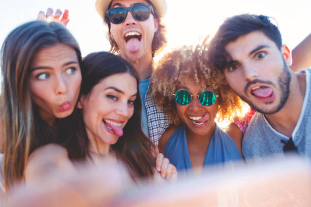 istock Group of friends having fun taking a selfie. 1305379830