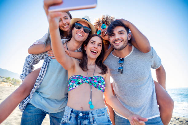 istock Group of friends having fun taking a selfie. 1305379835
