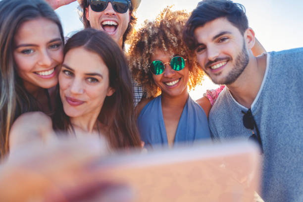 istock Group of friends having fun taking a selfie. 1305379836