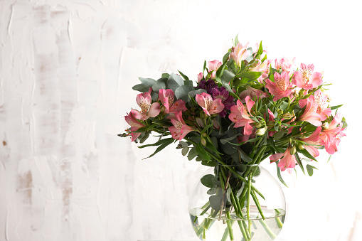 Alstroemeria or Peruvian lily flowers in blossom decorating a house table.
