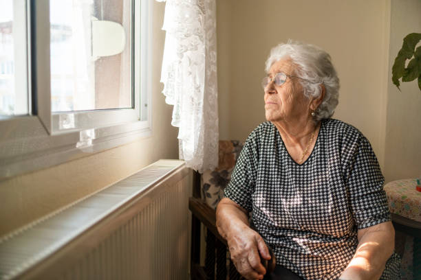 istock Old woman self isolating during coronavirus outbreak 1305382070