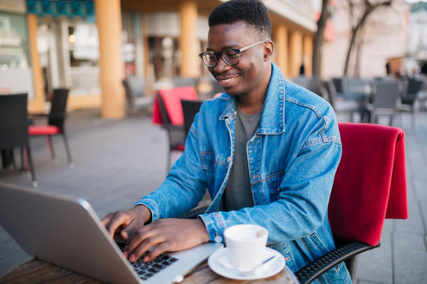 istock Happy African American male freelancer working casually 1305384113